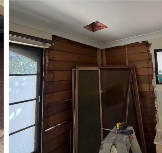 Before: interior room with old dark timber lining boards stripped back and a hole cut in the ceiling.